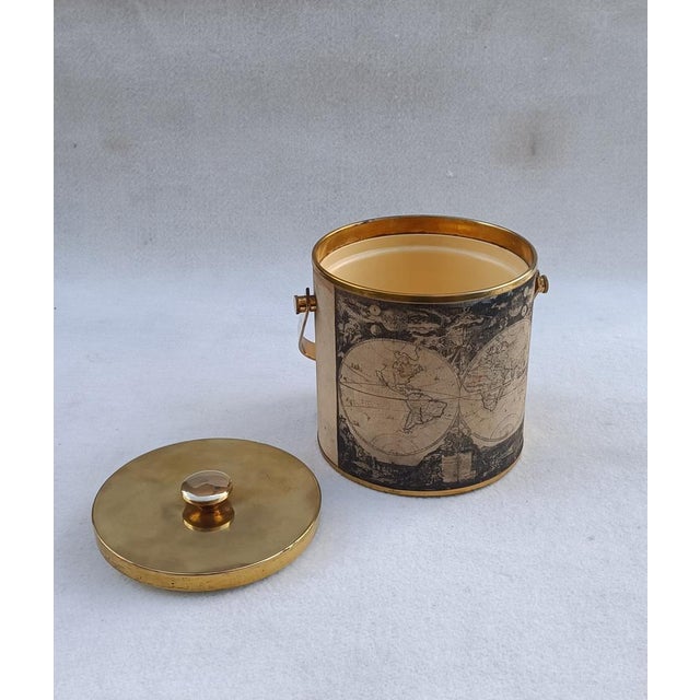 Brass ice bucket covered in fabric with a black and white map print. Italian product from the 1970s.