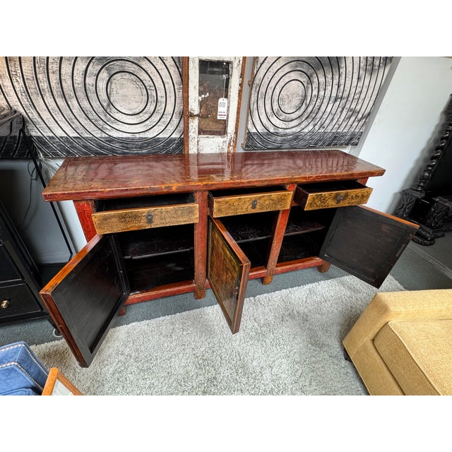 Design Plus Gallery presents a Late 19th Century Mongolian Sideboard. This antique cabinet has a long rectangular form...