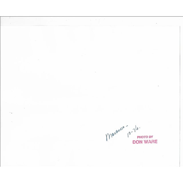 1976 black and white photograph by Los Angeles based photographer Don Ware of stores and a horse and wagon in Morocco....