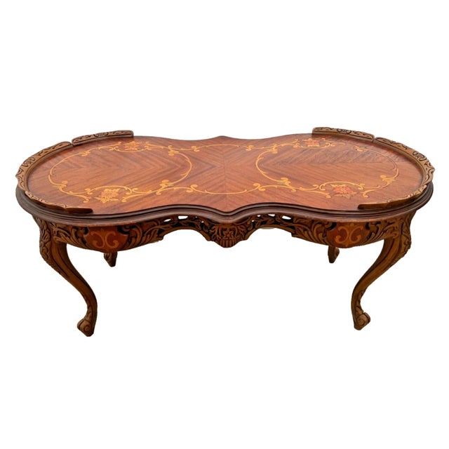 Elevate your living space with this breathtaking vintage coffee table, masterfully crafted in the Italian style. The...