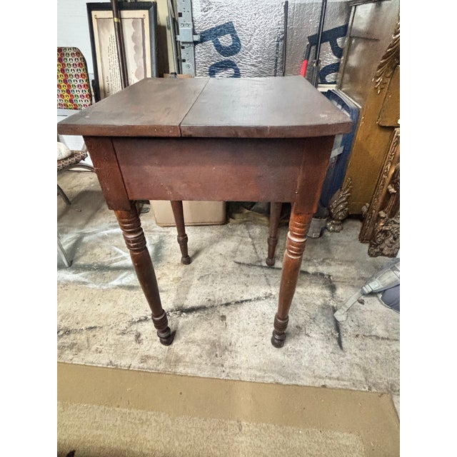 Late 18th century American side table made of cherrywood it has hand carved dove tails and rose head nails