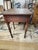 Late 18th century American side table made of cherrywood it has hand carved dove tails and rose head nails