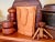 A signed and numbered hand carved wooden Shopping Bag sculpture by Venitian artist Livio De Marchi. Approx. dims: 7-1/2:H...