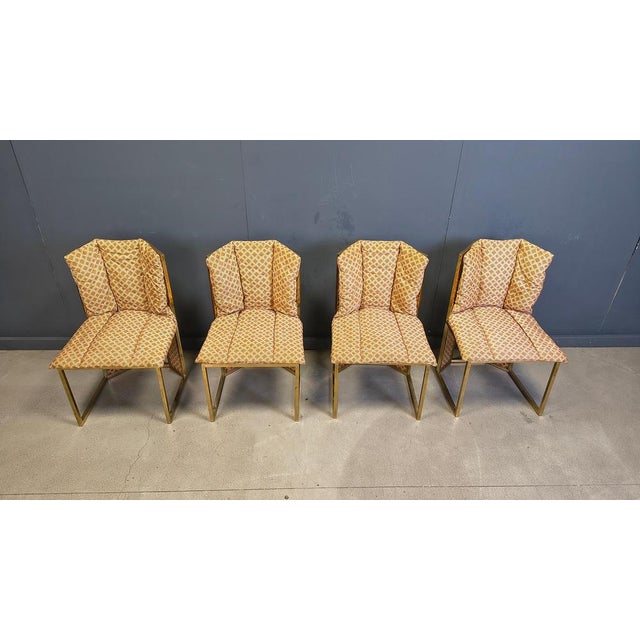 Set of 4 rare dining chairs produced by Mario Sabot featuring brass and wicker frames with the original cushions. Good...