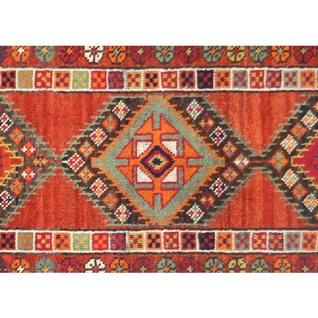 Handwoven vintage Turkish Oushak runner measuring 2'9" x 11'5". Crafted with wool on wool foundation in Western Turkey's...