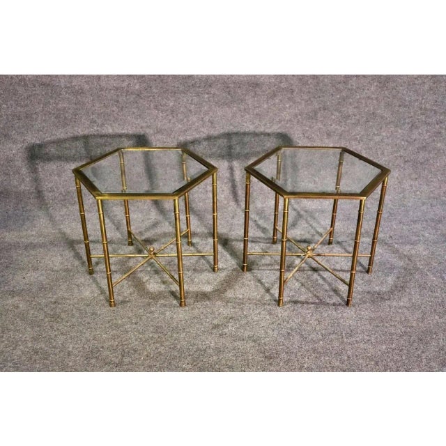 Brass faux bamboo frames. Glass tops. 17" h x 17 1/2" w x 20 1/8" d. Condition Scratches. Oxidation.