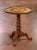 An intricate Alpine village scene and a richly carved pedestal make this antique Black Forest tilt-top table a distinctive...