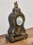 Elegant table clock in the Boulle style from the 19th century, characterized by a characteristic combination of a dark...