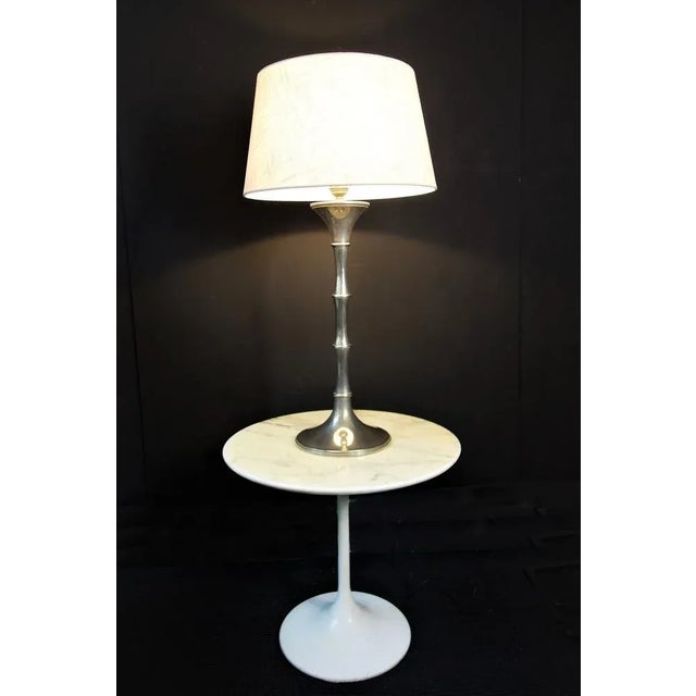 This 'Bamboo' table lamp was designed by Ingo Maurer in the 1970s. Nickel -plated shaft in the form of bamboo. Crémefarben...