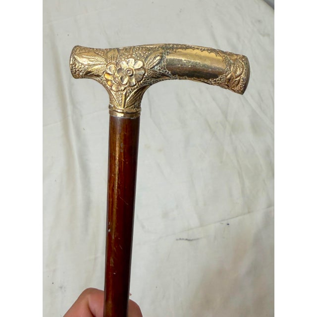 This antique 19th century Victorian hand chased yellow gold filled cane is a unique and elegant accessory. With its...