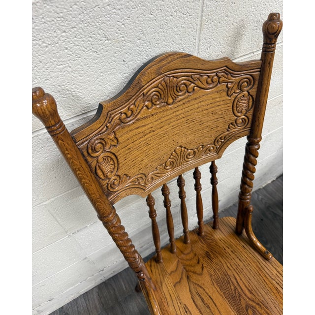 This is a gorgeous full set of four antique oak pressed back barley twist dining chairs dating to approximately 1900–1920....