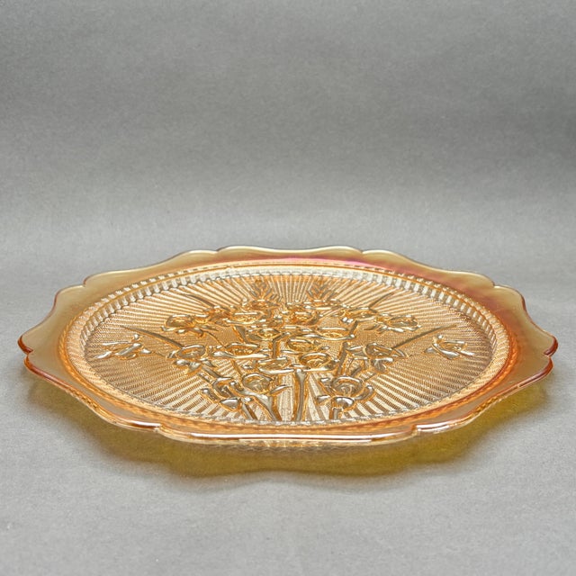 This stunning vintage marigold carnival glass cake plate features Jeannette Glass Company's classic Iris and Herringbone...