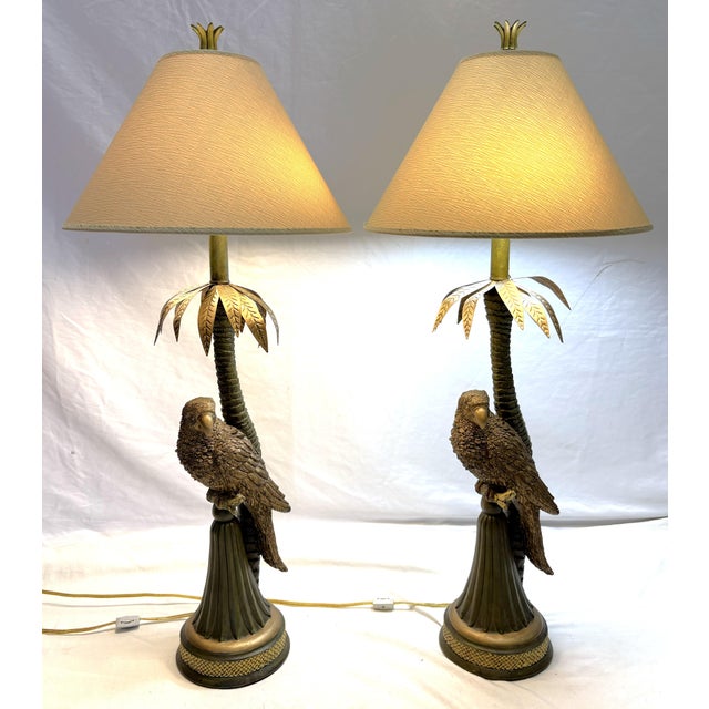 Fun tropical Palm Beach Chic table lamps from the late 20th century. These feature a parrot and palm tree design in a rich...