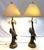 Fun tropical Palm Beach Chic table lamps from the late 20th century. These feature a parrot and palm tree design in a rich...