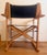 The folding director's chair, produced by Fratelli Reguitti and designed by Carlo Hauner in 1973. Made of solid wood with...