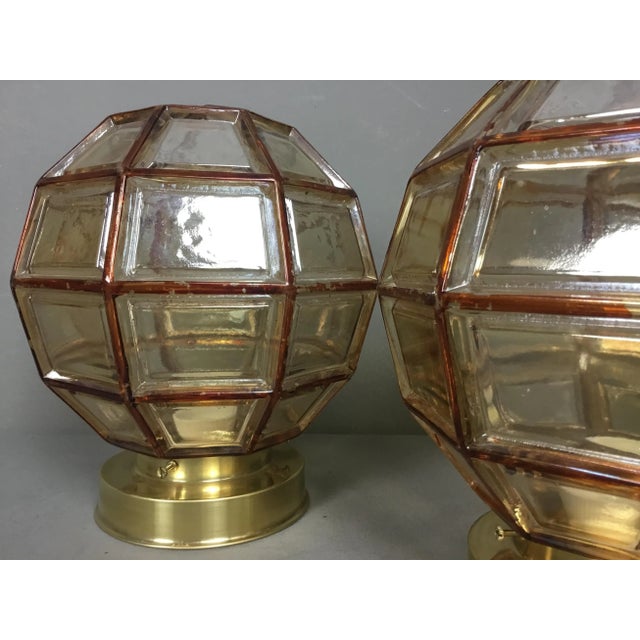 - Amber coloured geometric globes - Handcrafted glass, hand painted - Facetted and lined - Flush mount lamps - Atmospheric...