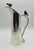 A rare and whimsical large silver-plated water pitcher designed and handcrafted in Taxco, Mexico by renowned artist Emilia...