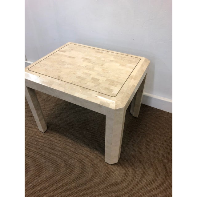 Maitland Smith tessellated fossil stone table with brass inlay. Made in the 1970s.