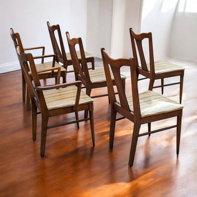 Set of six mid-century modern walnut dining chairs by Garrison Furniture with original plaid fabric seats. The set...