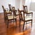 Set of six mid-century modern walnut dining chairs by Garrison Furniture with original plaid fabric seats. The set...