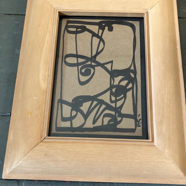 Original 4 x 6 marker drawing done on brown paper signed bottom right Laid down on black paper Overall size with wood...