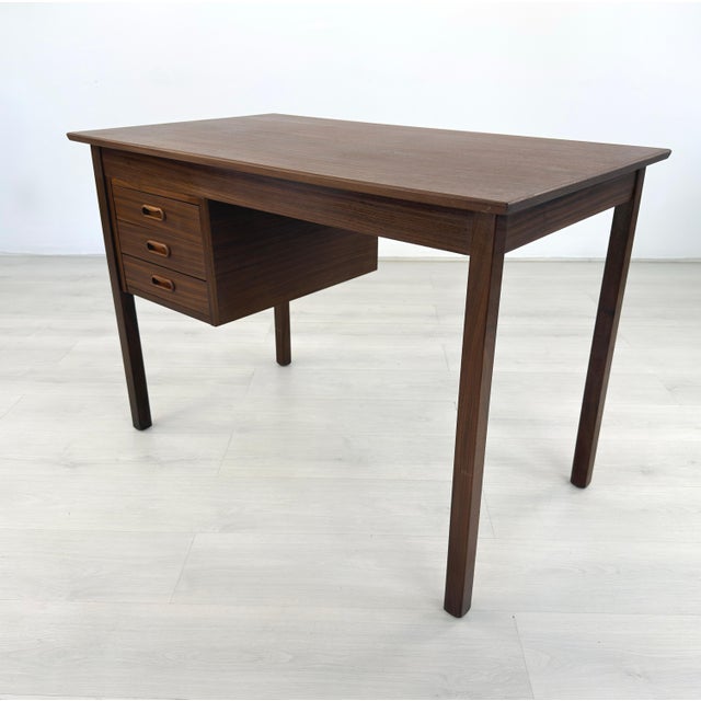 Dimensions: H 28.5” x W 41.3” x D 23.5” Vintage Scandinavian desk manner of Borge Mogensen with three drawers with...