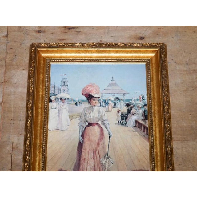 Antiques of London A graceful vintage Victorian-style print titled “Lady on the Pier” by Alan Maley, capturing a romantic...
