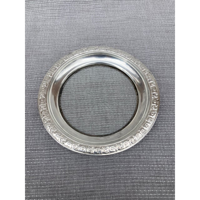 Vintage floral sterling rimmed, etched glass base wine coaster. Stamped sterling. Wear is consistent with age, use....