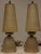 This is a nice pair of vintage Art Deco vanity lamps. They have soft gold frosted with stepped glass shades and matching...