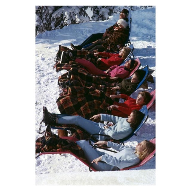 Winter Suntans 1961 Young women enjoy a relaxing sunbathe in snowy Gstaad. 1961. Slim Aarons Slim Aarons was one of the...