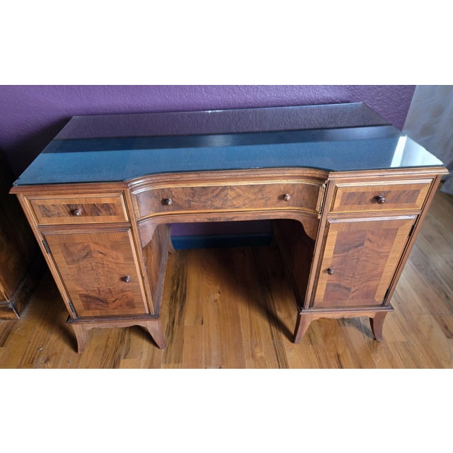 This is beautiful vintage ‘knee-hole’ desk was manufactured by the famous Karpen Furniture Company. It has intricate inlay...