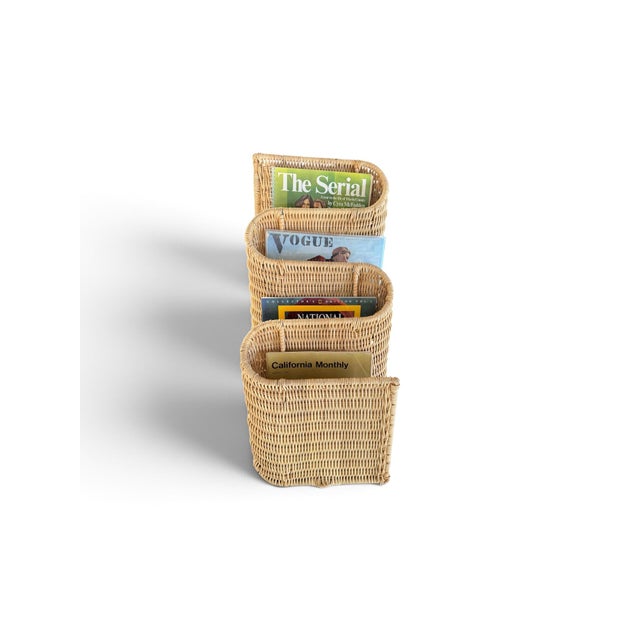 Vintage wicker magazine rack designed by Karl Malmvall for IKEA. Designed to hang from the wall vertically so the openings...