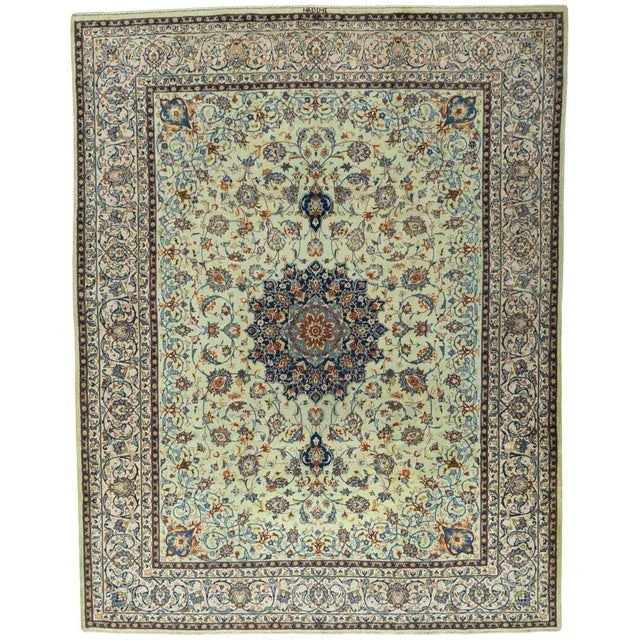 This exceptional hand-knotted Kashan rug is crafted from high-quality cork wool and impresses with its fine workmanship...