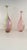 Pair of warm colored bottles with rounded shapes and long, proud necks. Great skills are required on the part of the...