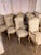An exceptional set of fourteen French Louis XV style dining chairs, including twelve side chairs and two armchairs,...
