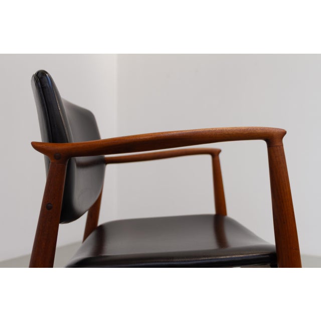 Danish Teak Captain's Chair by Erik Buck for Ørum, 1960s. Scandinavian Mid-Century Modern armchair in solid teak with...
