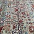Persian Farahan design hand-knotted rug featuring a luminous sage green field woven with an all-over interlocking trellis...