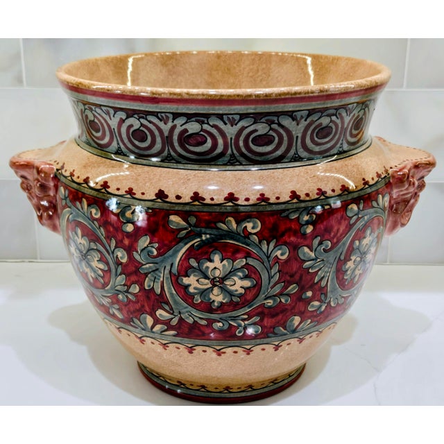 Hand-painted majolica jardiniere by Biagioli Ceramiche of Gubbio, Italy, featuring dramatic figural mask handles and...
