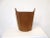 A very well crafted hand formed teak wood waste basket or magazine holder with sculptural handles to each side . Retains...
