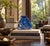 A finely hand-carved sculpture in natural fine grades lapis lazuli depicting the Buddha seated within an ornate alcove...