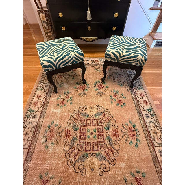Charming pair of custom-upholstered stools featuring a vibrant teal-and-ivory zebra-pattern textile. The bold upholstery...