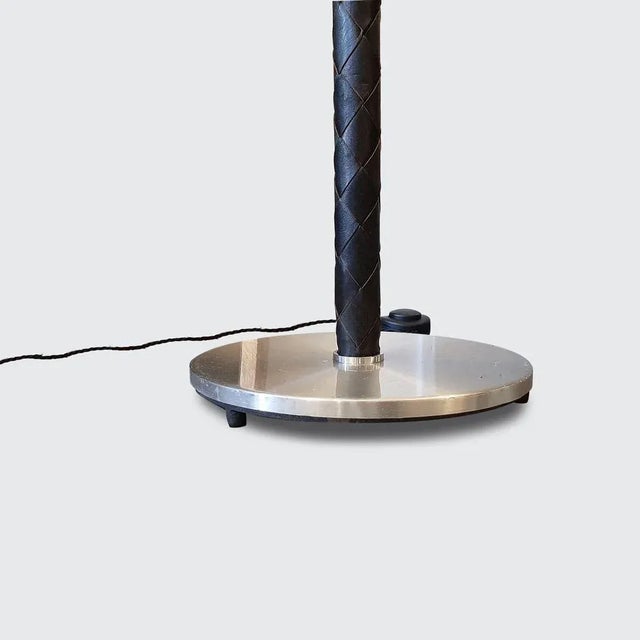 ‘Flet’ floor lamp by Jo Hammerborg. Made by Fog & Mørup. Aluminium and woven, black leather. Denmark, 1960s. Height 165...