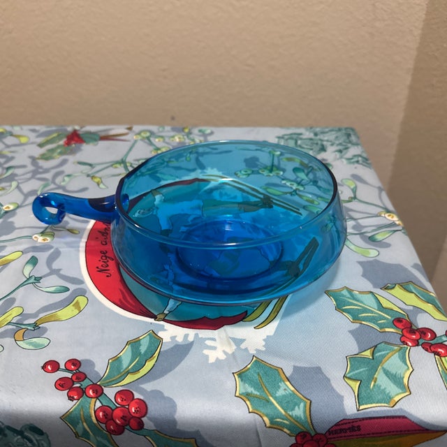 This striking Mid-Century Modern (MCM) art glass bowl features a vibrant peacock blue or turquoise hue. Crafted in Empoli,...