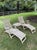A beautifully preserved pair of solid teak steamer chairs, likely British in origin and dating to the 1920s–1940s. Crafted...