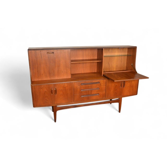 Origin: England Designer: Victor B. Wilkins Manufacturer: G Plan Era: 1966 Materials: Teak, Afromosia Measurements: 74″...