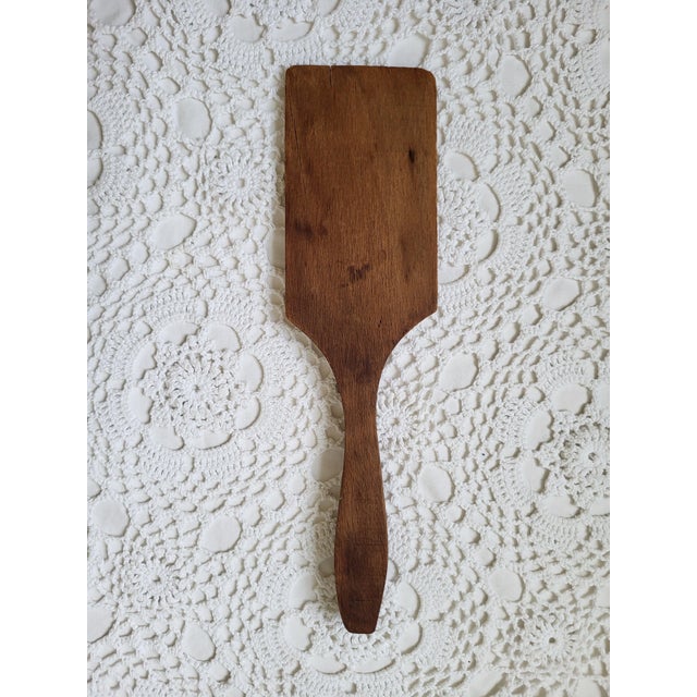 A pair of rustic primitive wooden paddles, perfect for everyday use or to display in a farmhouse kitchen. The larger...