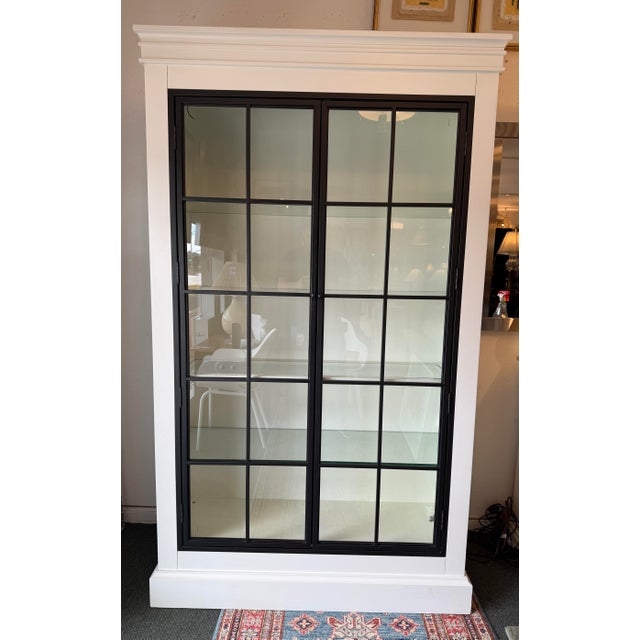 Design Plus Gallery presents the Delano Glass Door Cabinet from Ballard Designs. The distinctive doors of this cabinet...