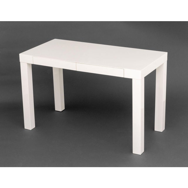 Modern White Lacquered Parson's Desk, with two short drawers. 30" H x 48" W x 24" D. Provenance: From an Upper East Side...