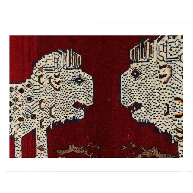 This Shiraz carpet originates from Persia and has been knotted from nomads in a smaller town. Its size is 2'5" by 5'...