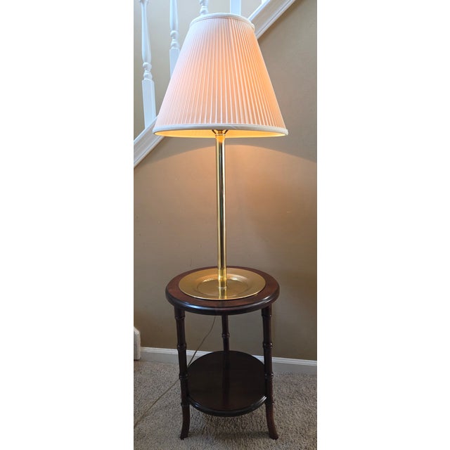 Vintage Regency style faux bamboo wood and brass tray side table floor lamp. Features solid wood carved faux bamboo base...